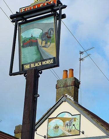 Pub's signs with two different barges illustrated