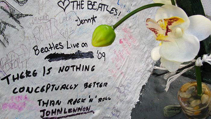 Flowers on the wall, with dedications to the Beatles. Most of these are in memoriam of John Lennon