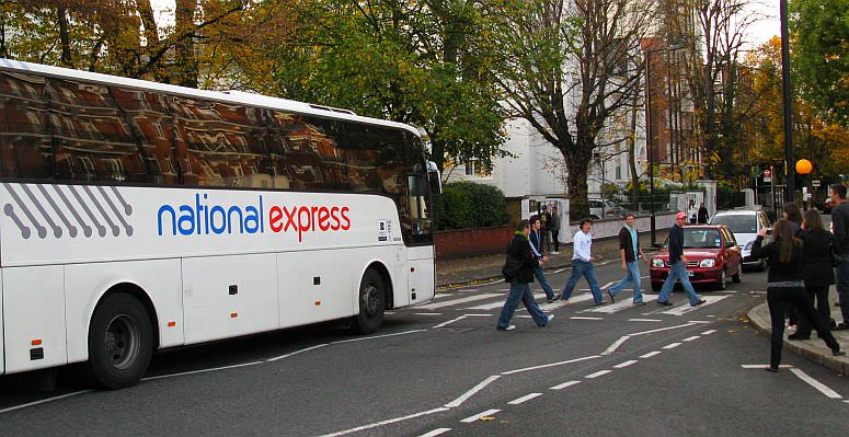 Traffic stops whilst visitors do a George, Paul, Ringo and John! (plus a fifth - some might assert that it symbolises Brian Epstein)
