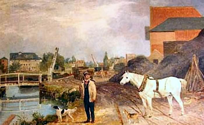 Wandsworth Bason where the Surrey Iron Railway began. A fixed bridge across the canal and two cranes can be seen