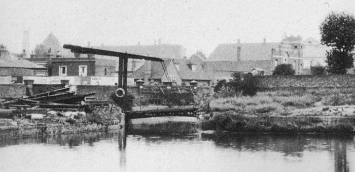 The canal and its lift bridge at what is now Armoury Way. The only building left from this 1930's scene is the church tower of St Ann's which is faintly seen at far left liftbr.jpg