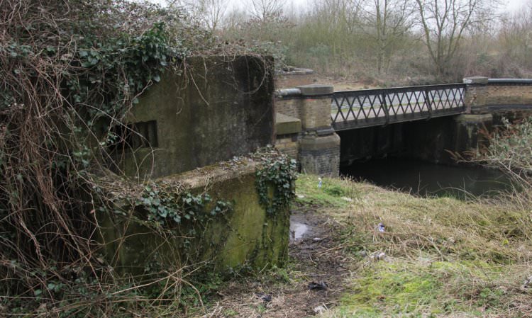 The aqueduct over the Frays River with a sentinel guard - the pill-box - adjacent to it